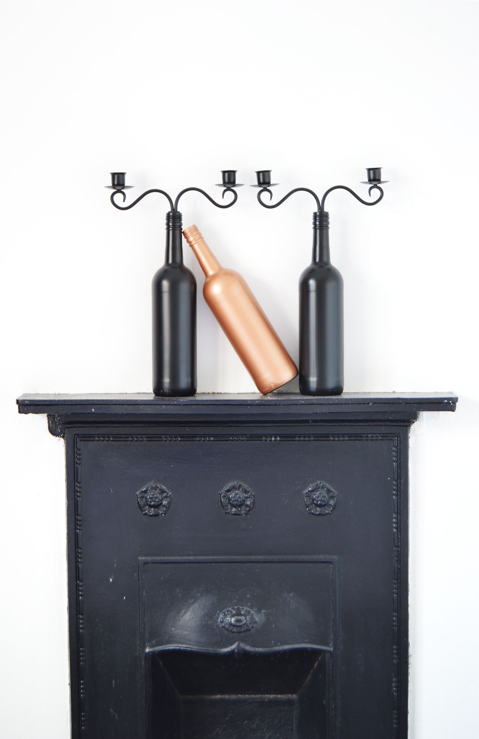 DIY wine bottle candle holder is easy to make and all you need is spray paint and wine bottles. With just painting the bottles, you can turn them into something stylish and pretty.