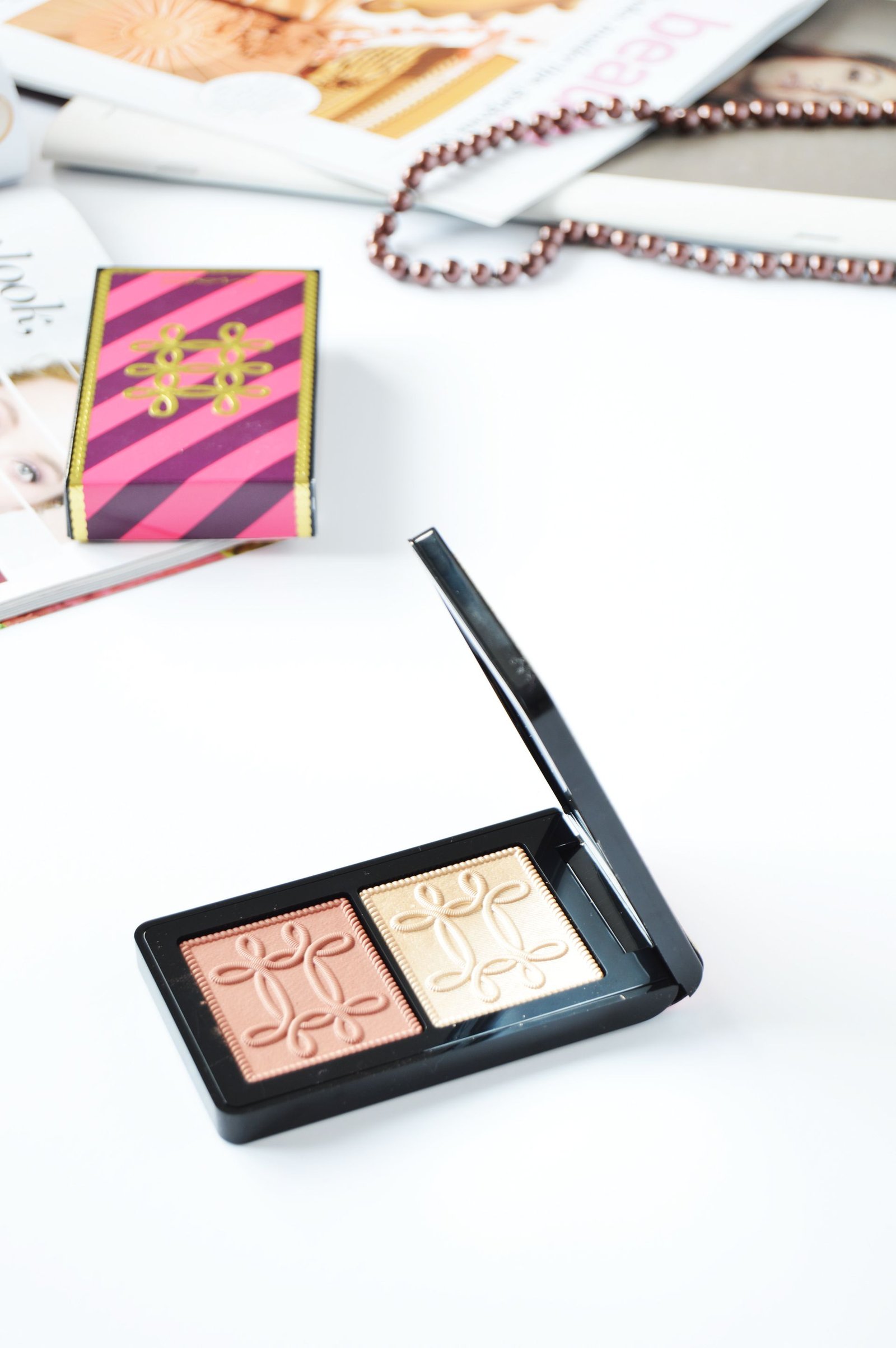 MAC Nutcracker Sweet Copper Face Compact contains Whisper of Gilt and Pleasure Model. Fuchsia&Burgundy packaging with gold embroidered accents is so festive and catchy. This is one of the holiday releases that you shouldn't miss out.